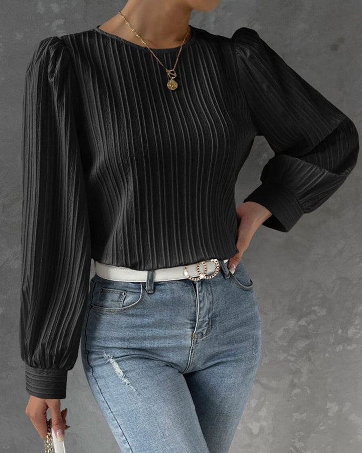 Elegant women's top, a versatile round neck blouse with stylish lantern sleeves for any occasion.