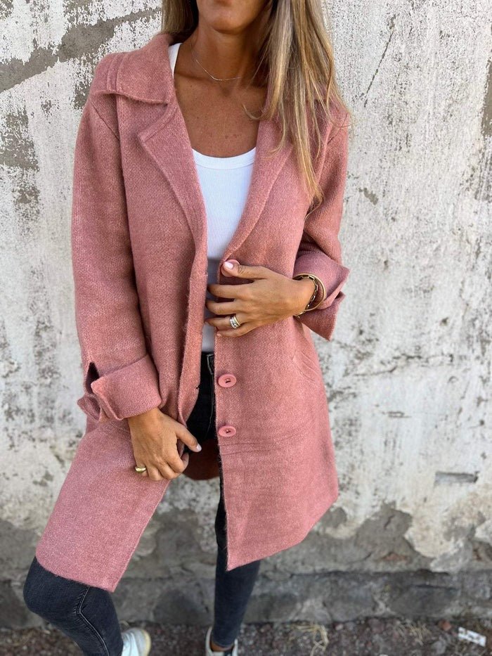 Chic button-front long coat for women, featuring a stylish lapel collar. Versatile autumn fashion.
