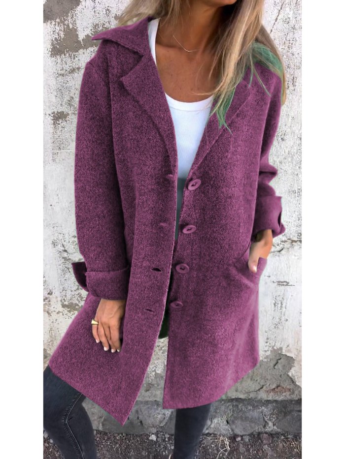 Stylish women's outerwear: a long lapel coat with chic button details. Perfect for autumn & winter.