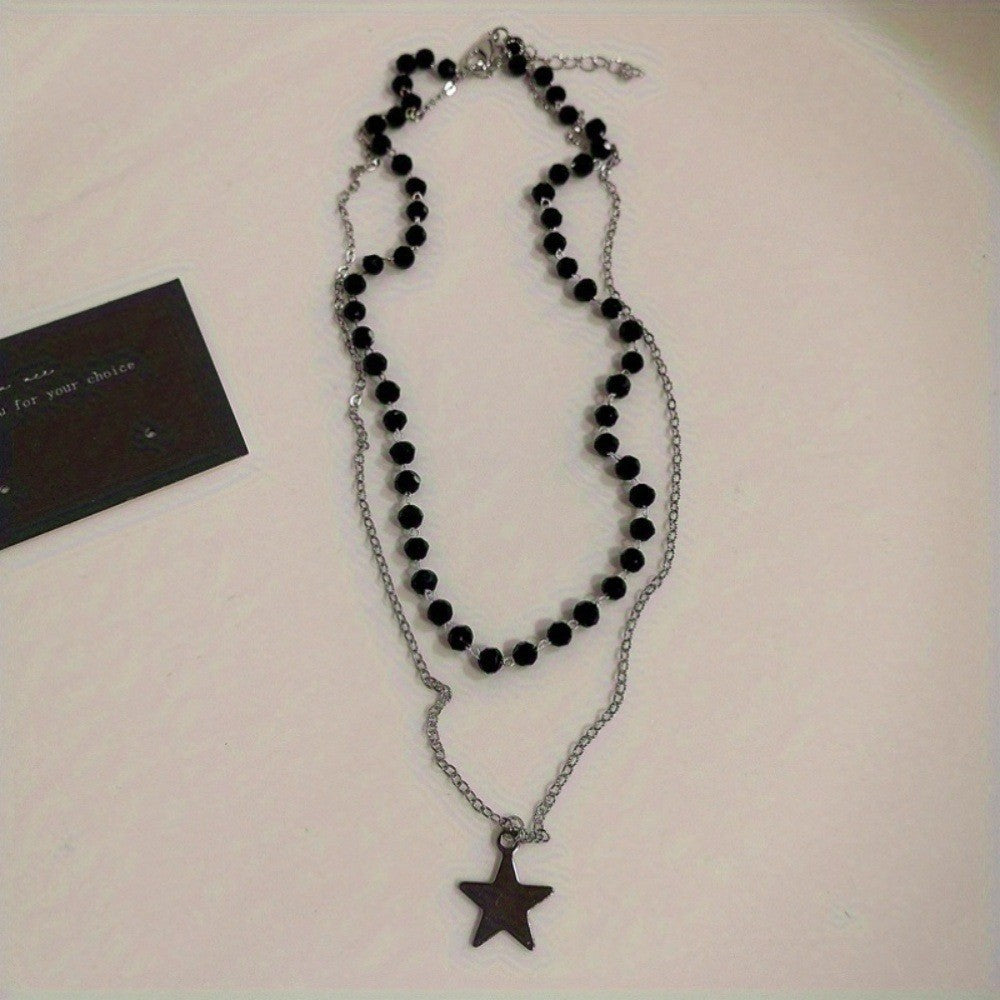 Gold-tone layered beaded necklace for women, showcasing a meaningful cross and celestial star pendant. Faith jewelry.