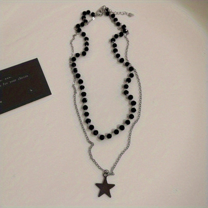 Gold-tone layered beaded necklace for women, showcasing a meaningful cross and celestial star pendant. Faith jewelry.