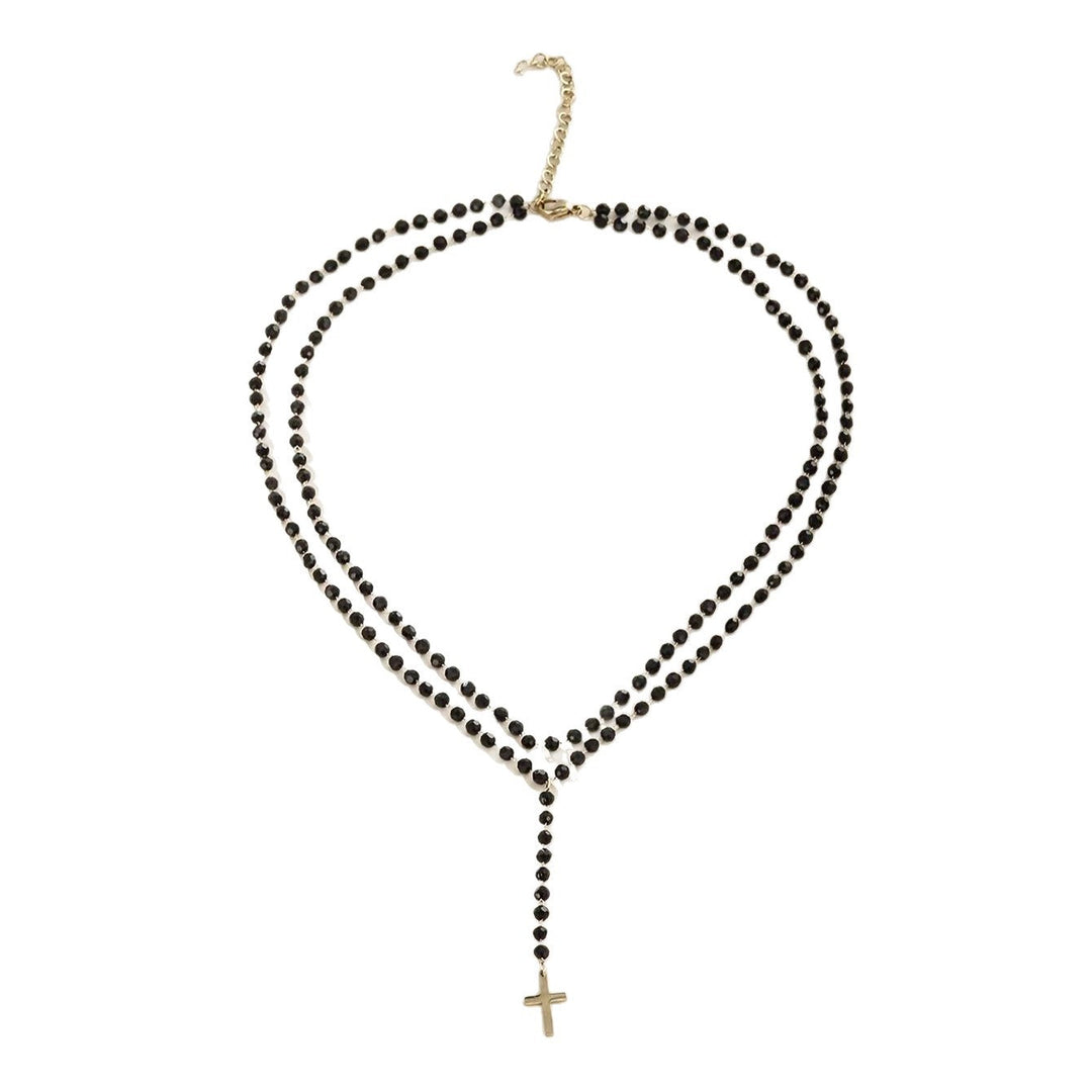 Beautiful women's layered beaded necklace with cross and star pendants, an elegant faith accessory or spiritual gift.