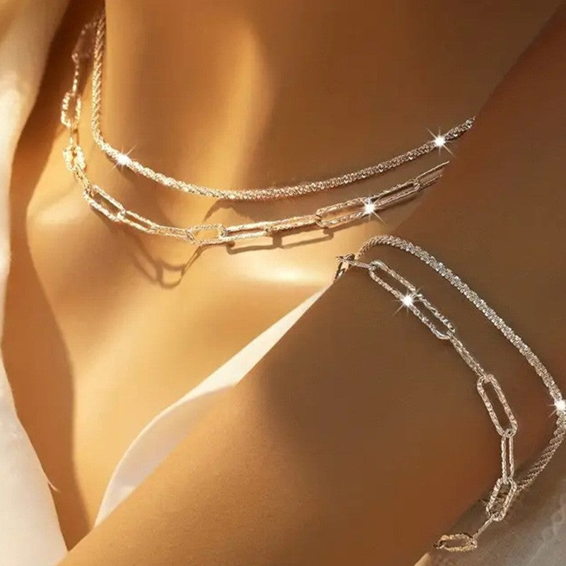 Elegant women's layered chain necklace, delicate gold-tone fashion accessory, adjustable for perfect fit.