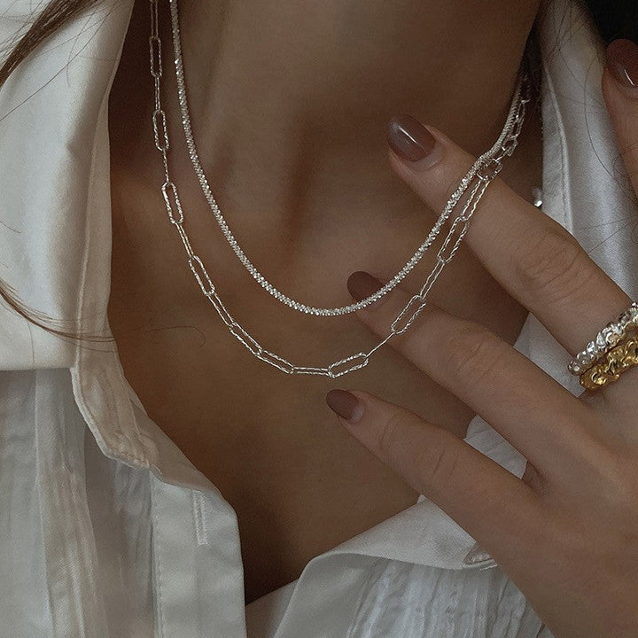 Dainty women's layered chain necklace, gold adjustable choker & longer chains, chic everyday accessory.