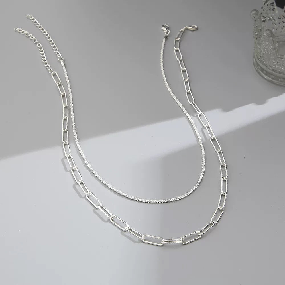 Versatile women's layered chain necklace, elegant silver fashion jewelry, perfect for any outfit.
