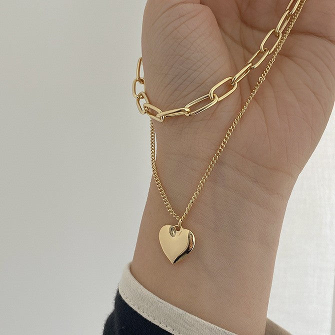Chic layered heart pendant necklace for women, a beautiful and elegant fashion statement accessory.