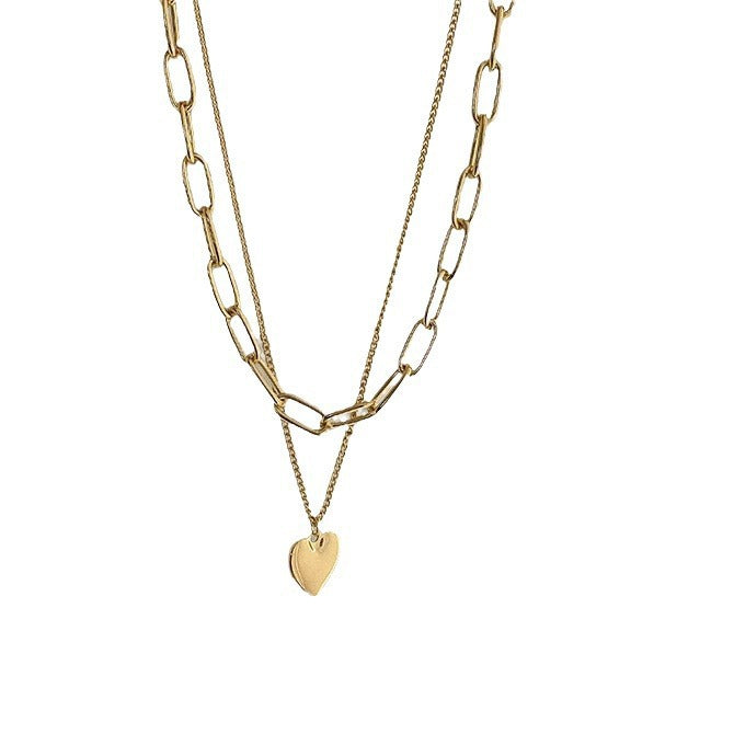 Women's gold chain layered necklace with various heart-shaped charms, an ideal gift for her.