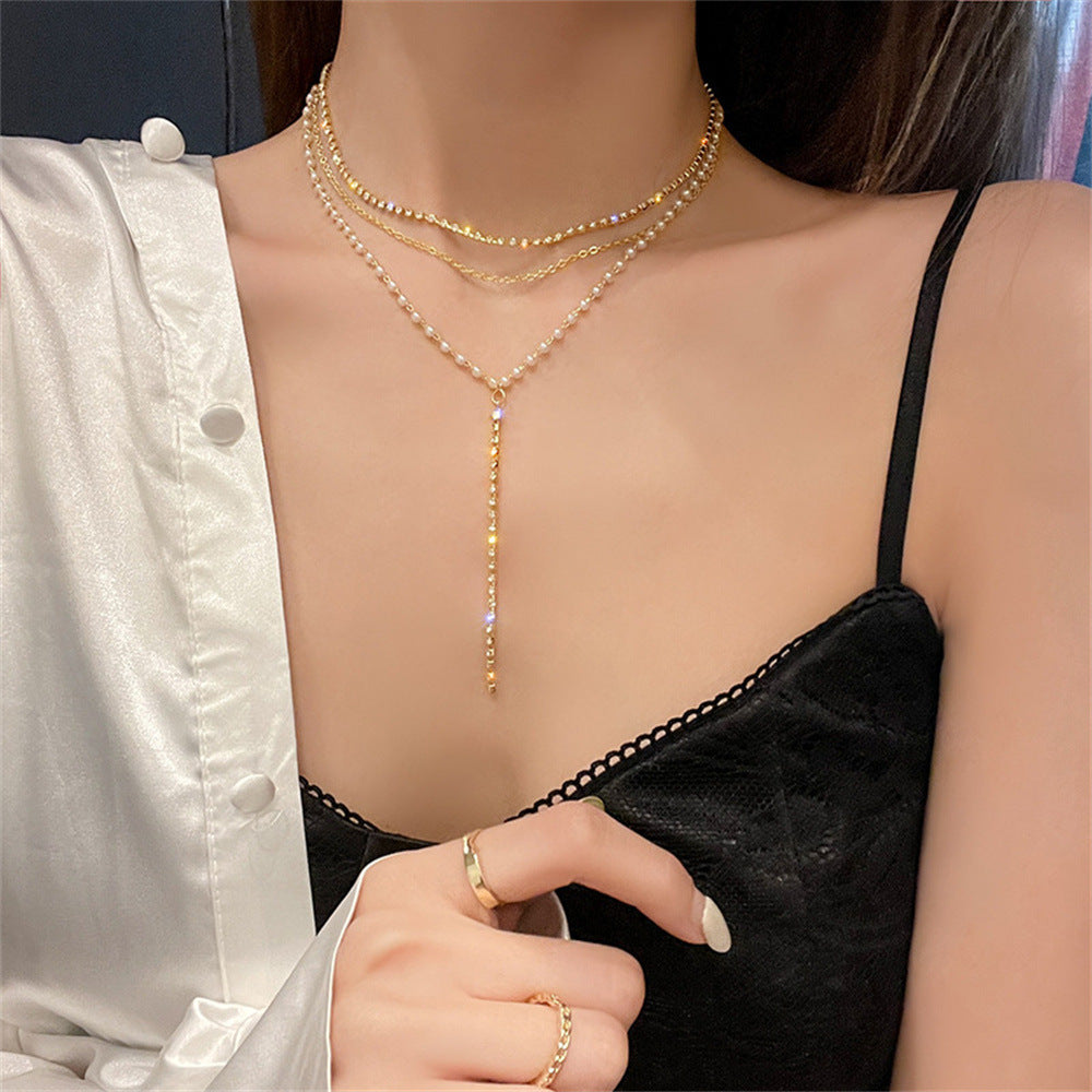 Sparkling layered crystal & pearl necklace for women. Chic multi-strand statement jewelry, an adjustable gift for her.