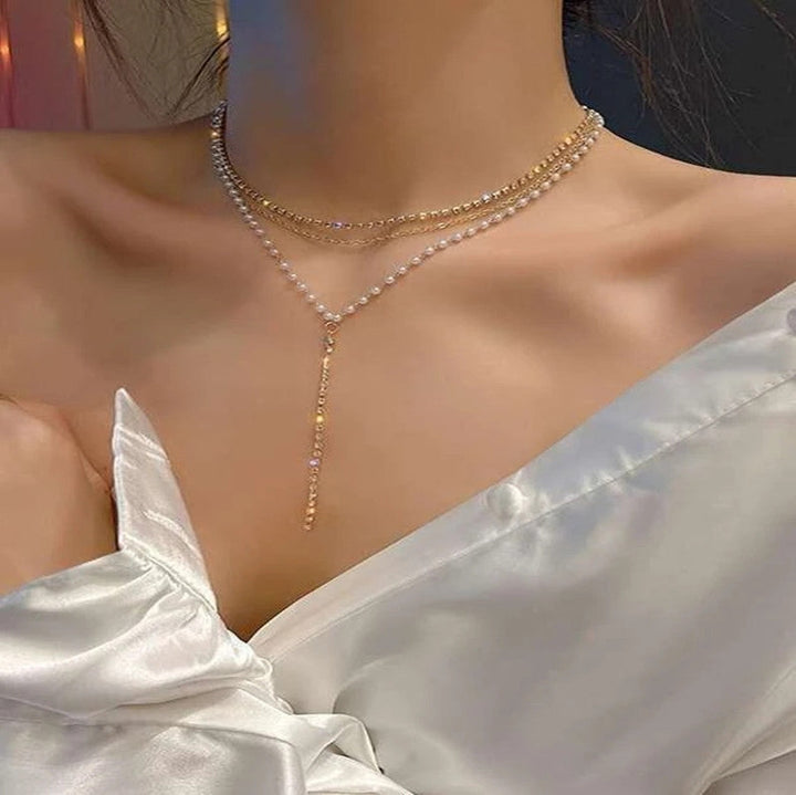 Women's multi-strand crystal and pearl necklace. Glamorous, elegant fashion accessory with adjustable length.