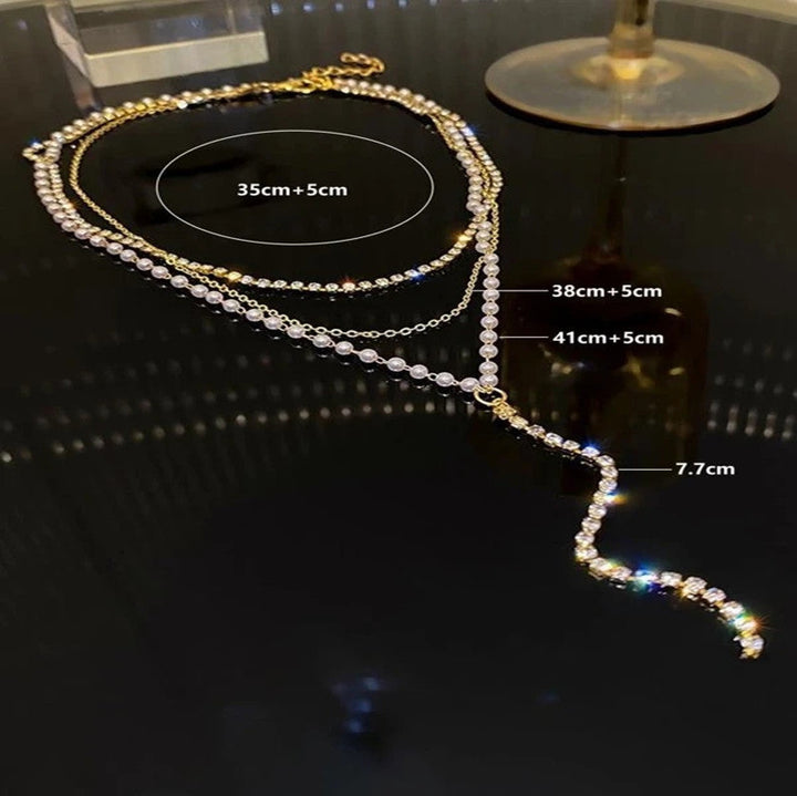 Women's elegant layered necklace featuring lustrous pearls and sparkling crystals. A sophisticated fashion accessory.