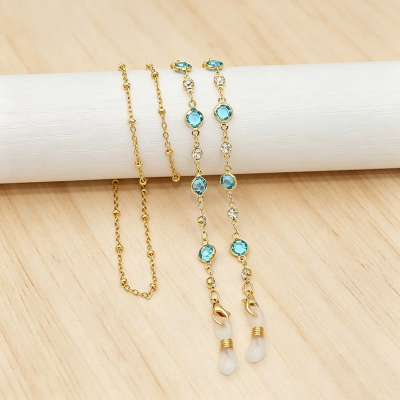 Versatile women's layered crystal necklace in gold tone, vibrant colorful gems, elegant statement jewelry.