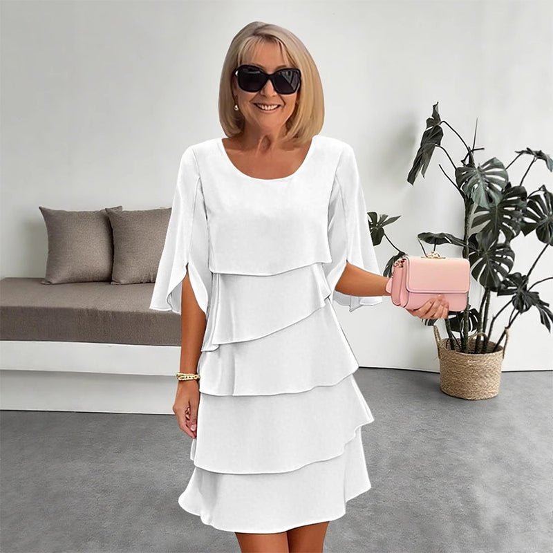 Stylish women's long sleeve layered dress. Flowy design, elegant occasion wear or versatile party dress.