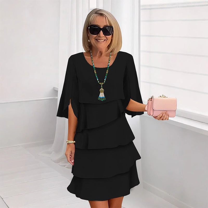 Fashionable women's elegant layered dress for events. Flowy silhouette, perfect party wear & summer style.