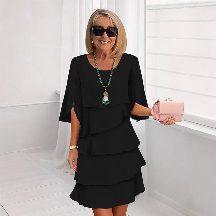Fashionable women's elegant layered dress for events. Flowy silhouette, perfect party wear & summer style.