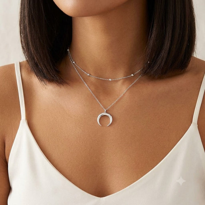 Delicate celestial layered necklace with crescent moon charm. Adjustable gold-tone jewelry, ideal gift for her.