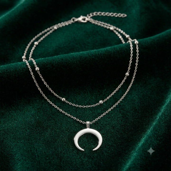 Stylish women's layered necklace featuring a minimalist crescent moon pendant. Versatile fashion jewelry for her.