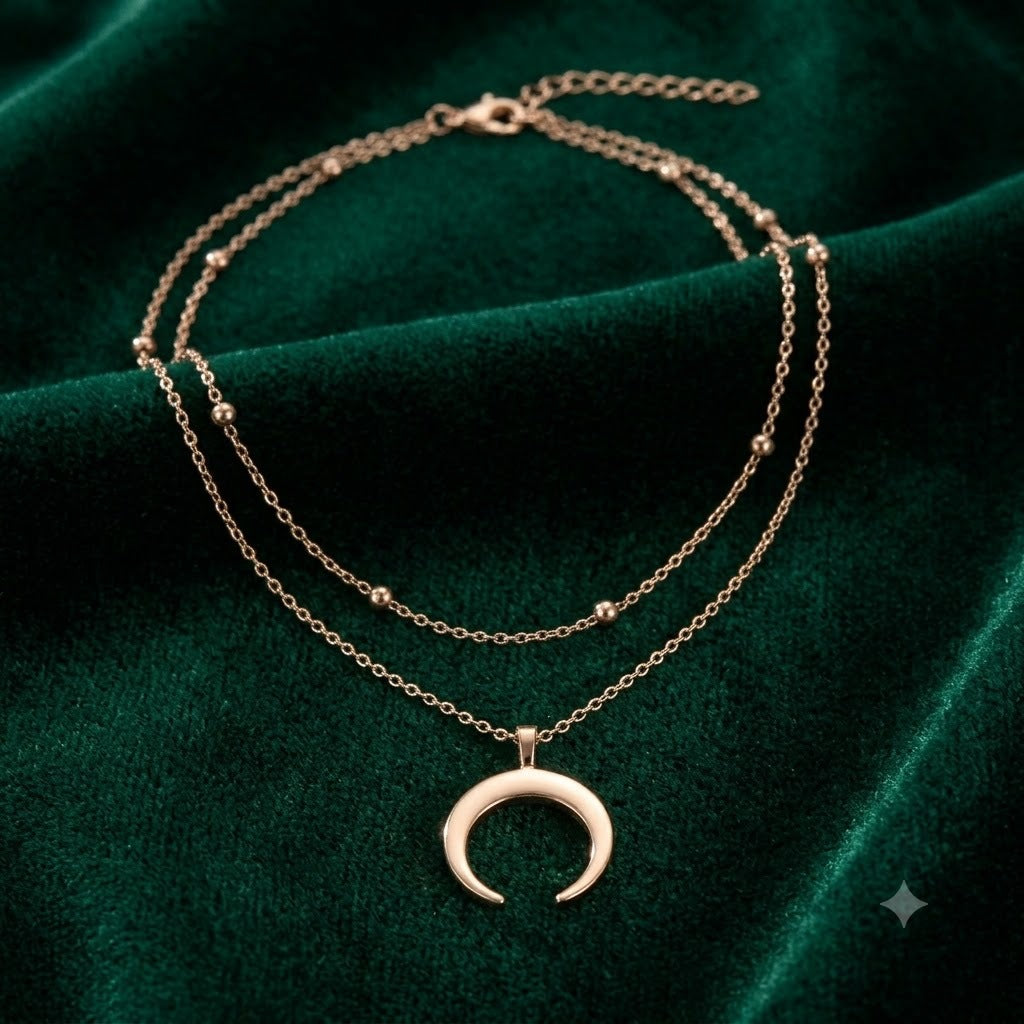 Exquisite gold-plated layered necklace with a sparkling crescent moon pendant. Delicate and elegant women's jewelry.