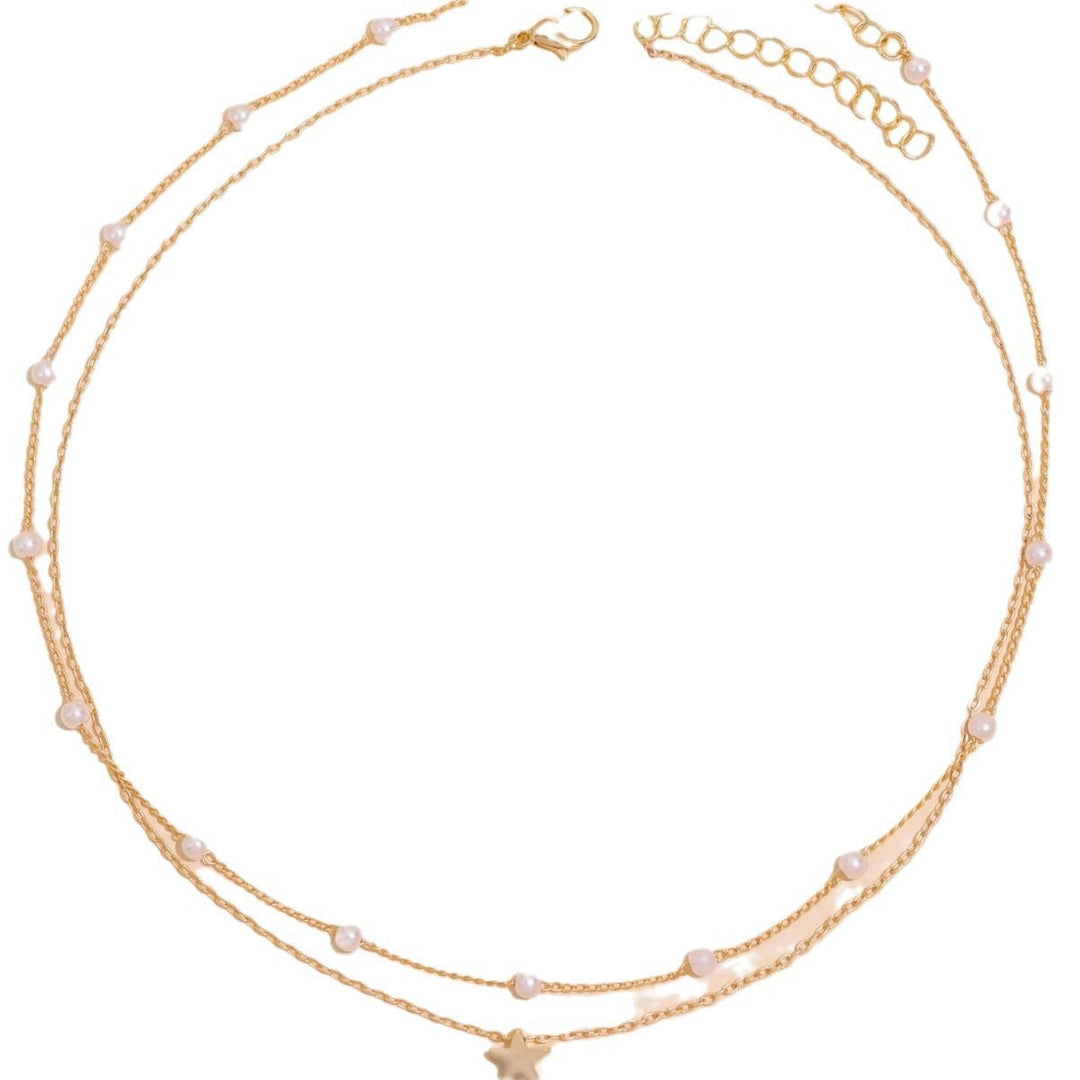 Beautiful layered pearl and star pendant necklace in gold, an elegant gift for her, perfect women's jewelry.