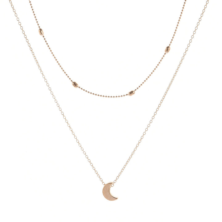 Versatile silver layered necklace with a beautiful heart charm, essential women's fashion jewelry.