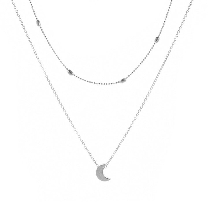 Chic layered necklace with heart, moon, and star charms. Elegant gold tone womens jewelry gift.