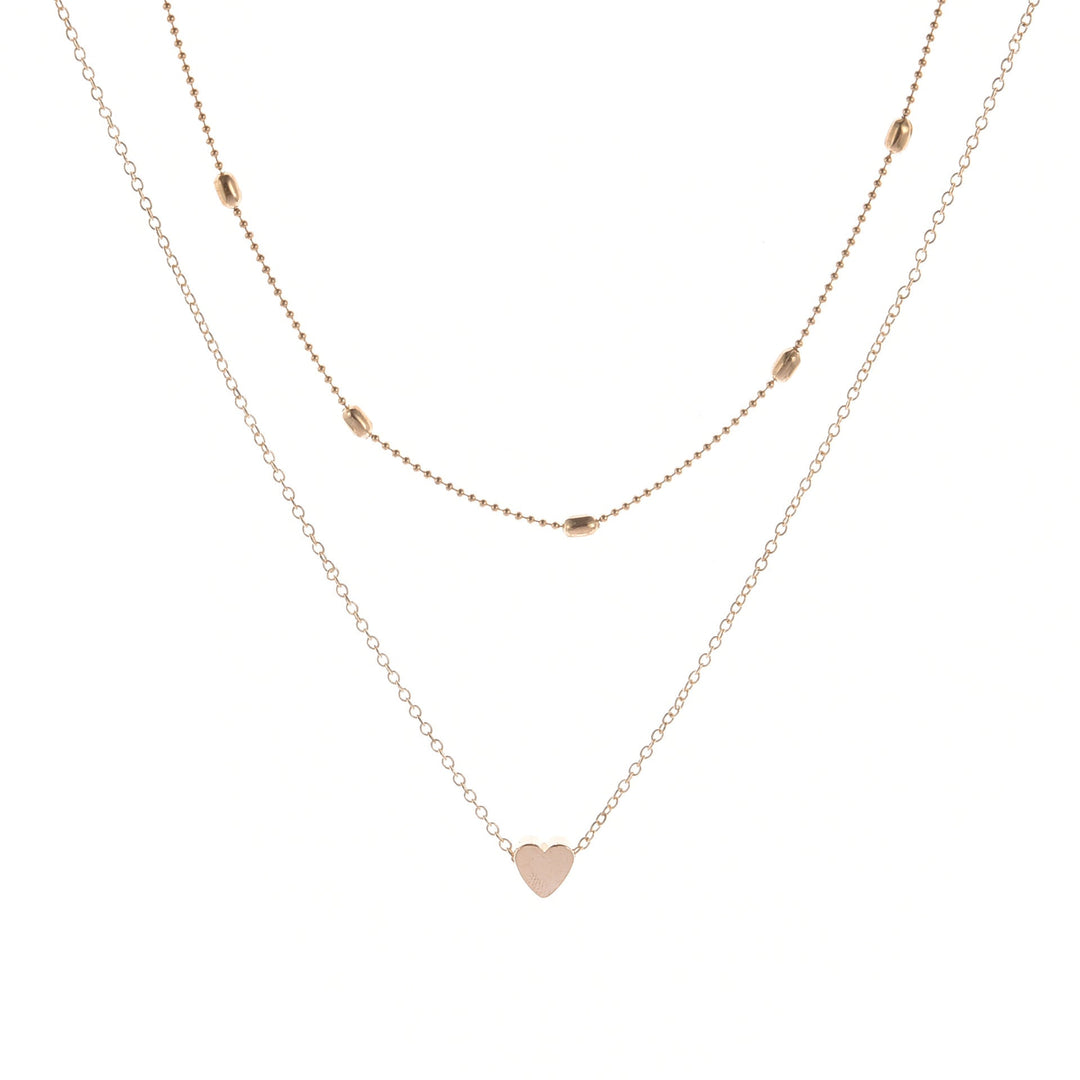 Fashionable layered heart charm necklace for women, suitable for any occasion. Gold and silver options.