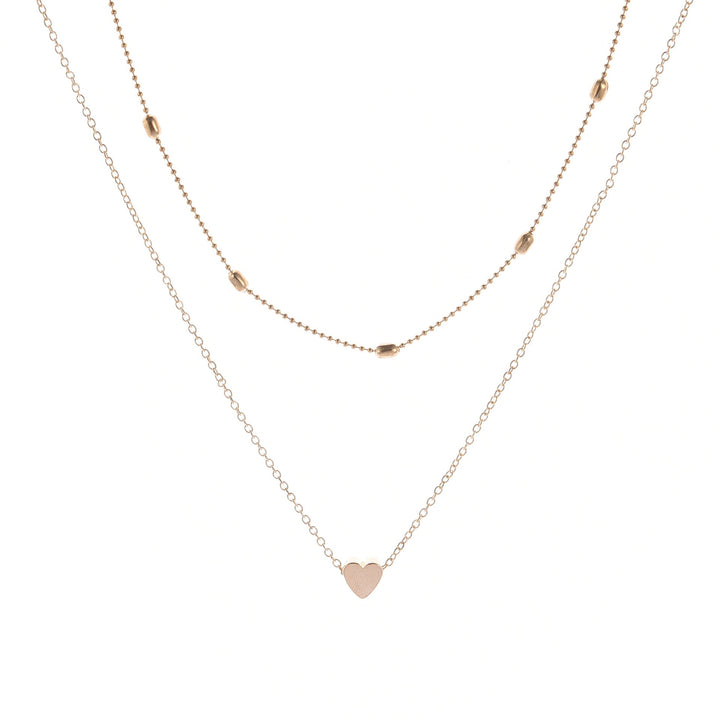 Fashionable layered heart charm necklace for women, suitable for any occasion. Gold and silver options.