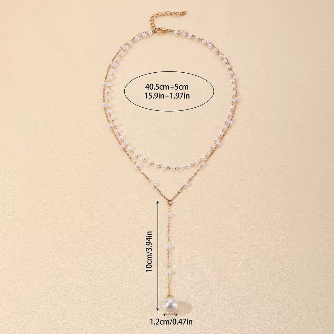 Beautiful white pearl & gold layered necklace, a stylish accessory for women's fashion.
