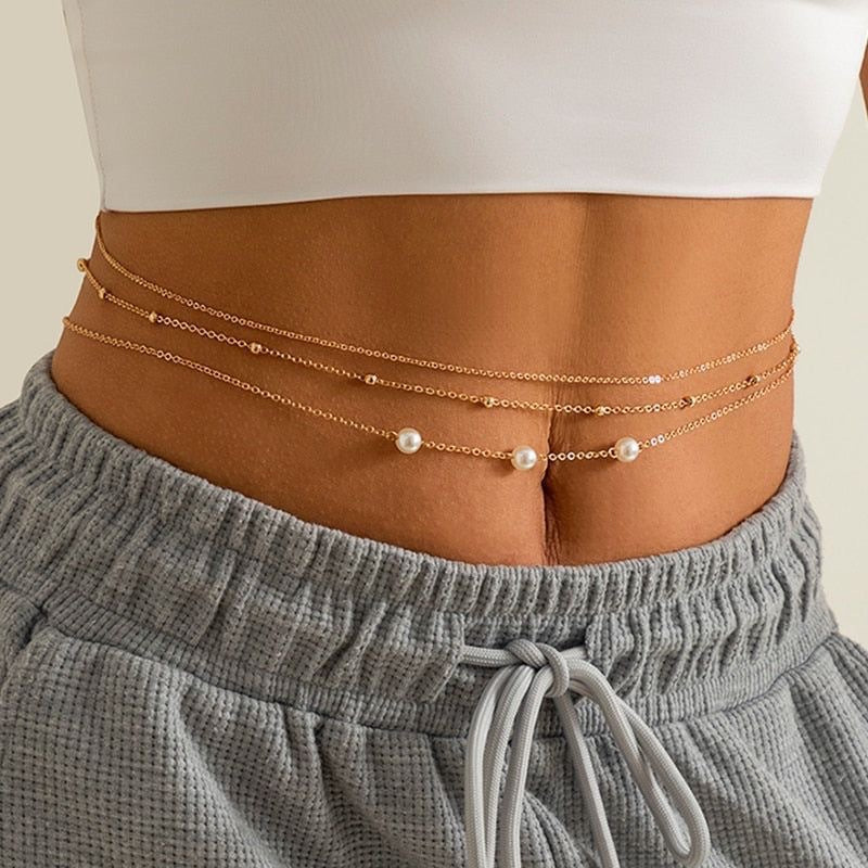 Elegant women's layered pearl necklace featuring multiple strands of white beads & a gold clasp. Perfect fashion accessory.