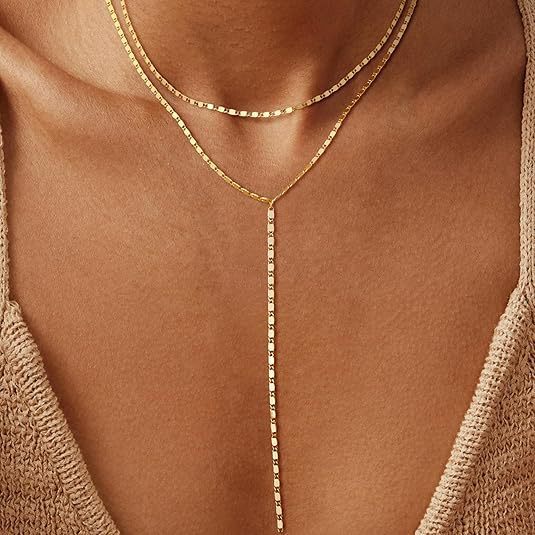 Stylish women's layered rhinestone drop necklace. Versatile fashion jewelry, adding sparkle and elegance to outfits.