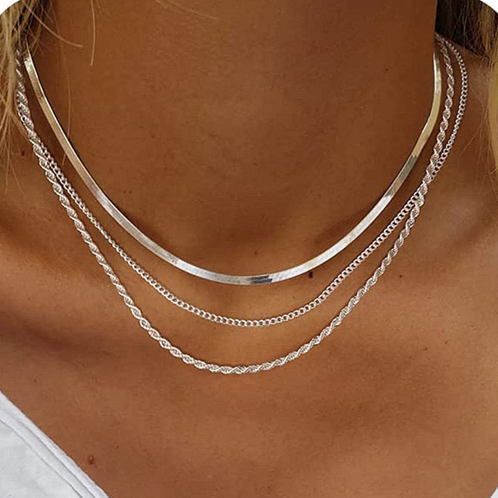 Elegant women's layered textured gold chain necklace, a chic fashion accessory for modern style.