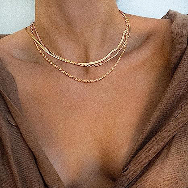 Adjustable multi-layered gold chain necklace, a versatile textured women's fashion accessory.