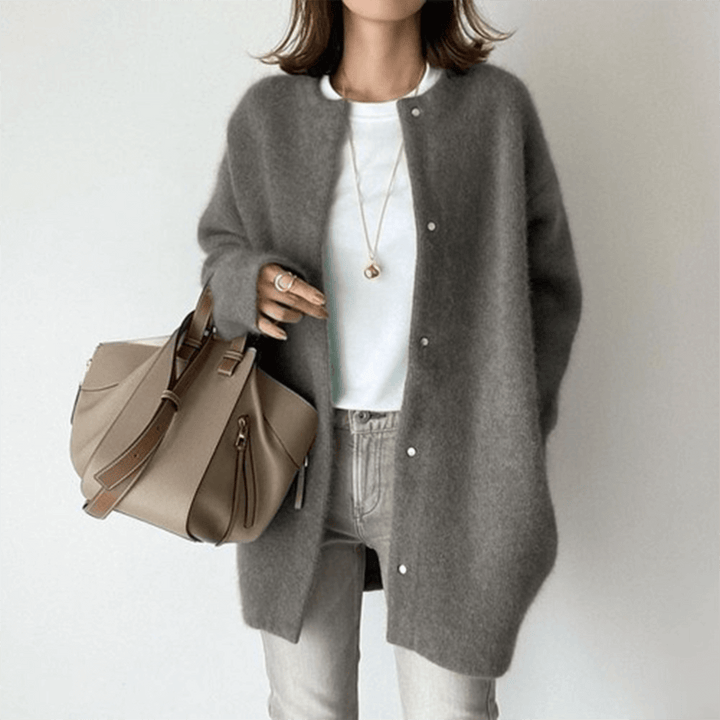 Soft knit women's elegant cardigan, providing cozy comfort and a versatile layering option for women.