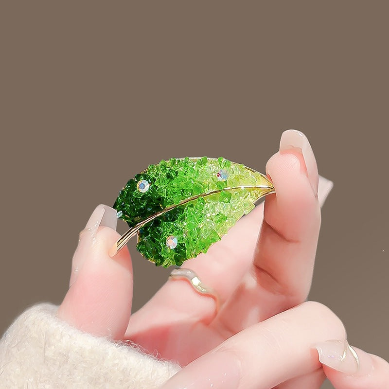 Luxury nature leaf brooch for women, featuring elegant sparkling accents, an ideal sophisticated gift.