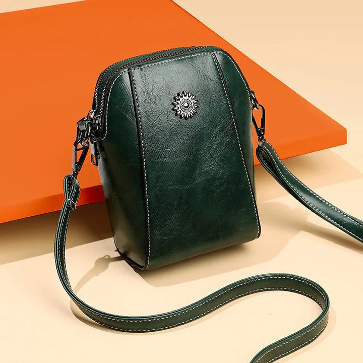 Elegant women's leather shoulder bag with adjustable strap, perfect for daily use & chic style.