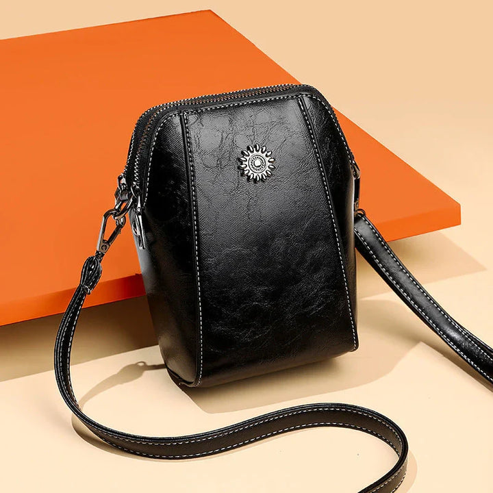 Versatile women's leather everyday purse, a chic fashion accessory with an adjustable shoulder strap.