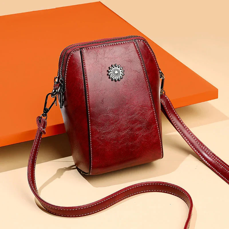 New elegant women's leather shoulder bag with an adjustable strap, a chic everyday fashion accessory.