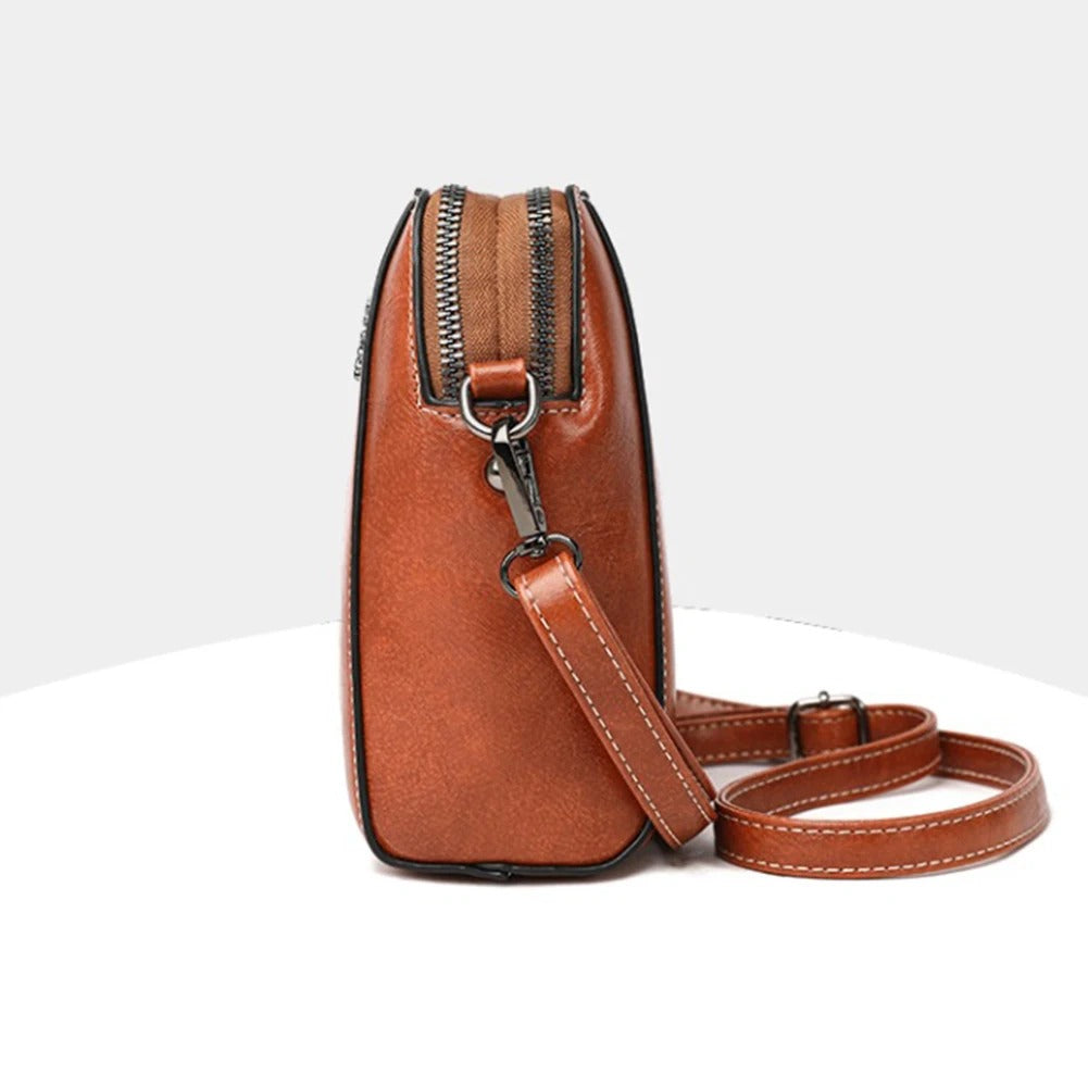 Adjustable women's leather shoulder bag, an elegant everyday purse for stylish daily use.