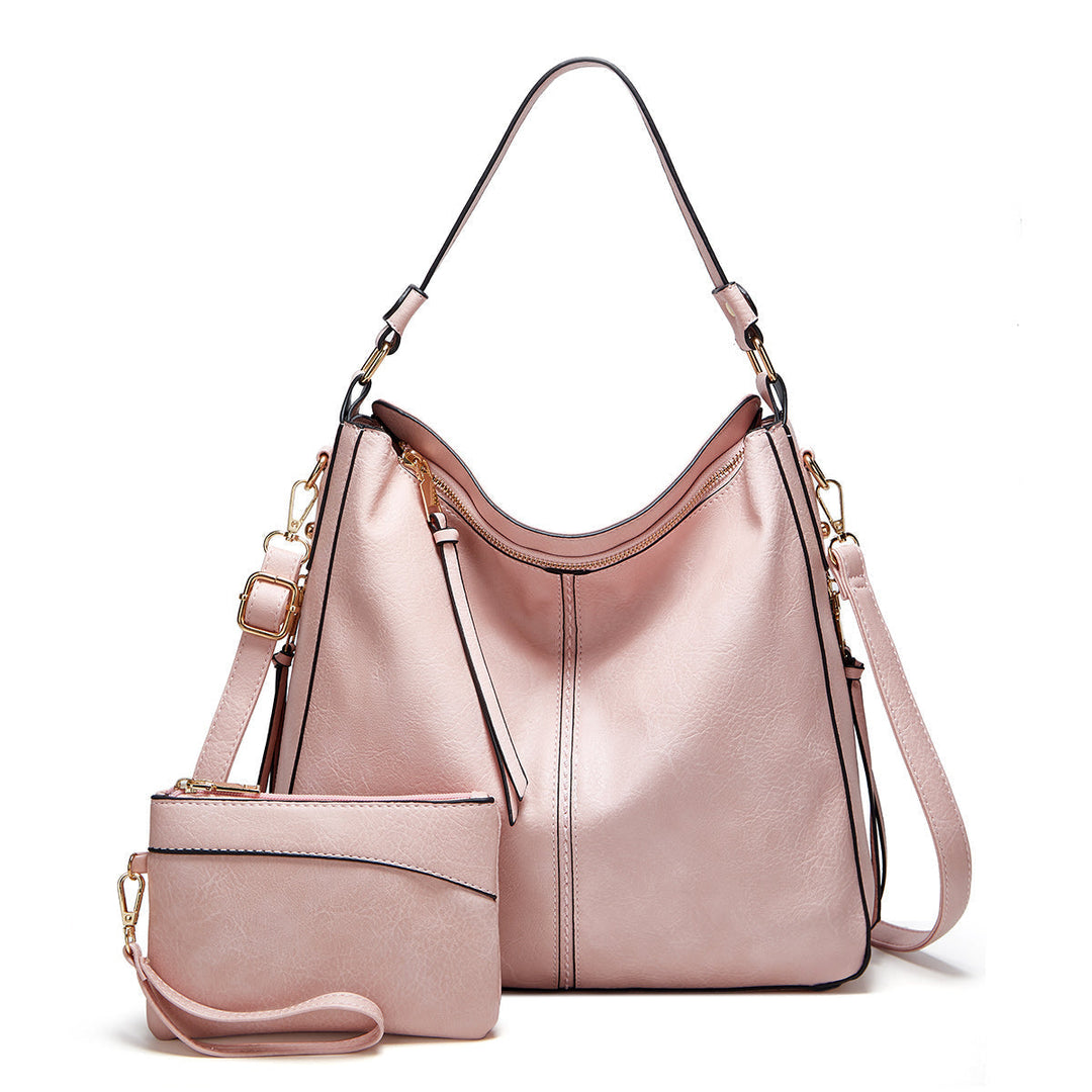Fashionable women's leather handbag, a must-have accessory with luxurious gold accents & spacious design.