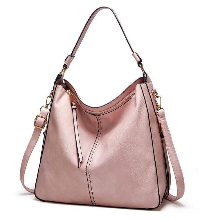 Beautiful women's leather shoulder bag, premium craftsmanship, enhanced by elegant gold details.