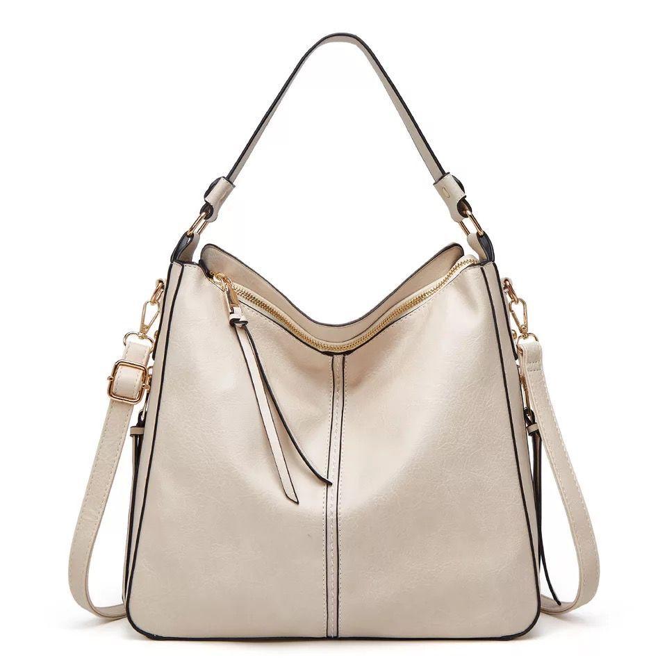 Organized women's leather crossbody bag, premium quality, featuring sleek design & gold accents.