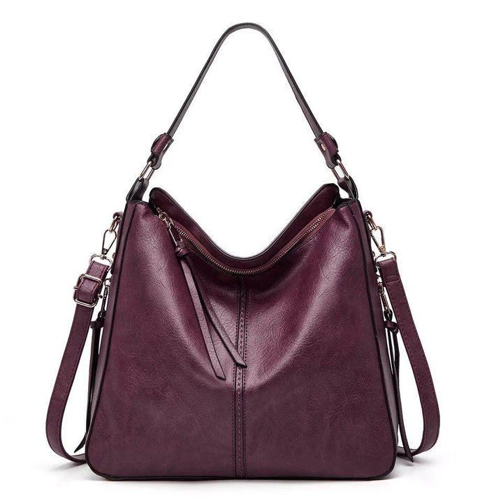 Luxurious women's leather handbag, a stylish fashion accessory with elegant gold details.
