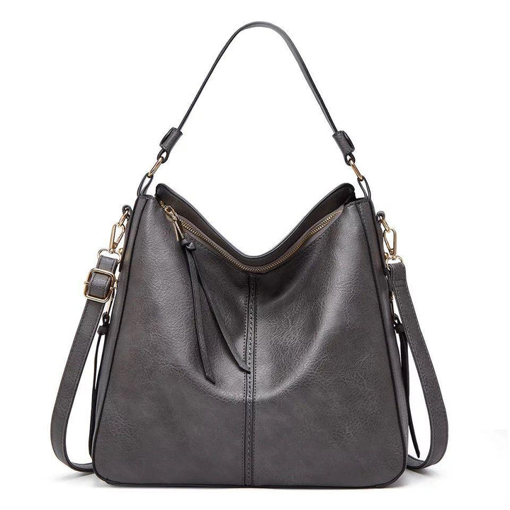 Premium quality women's leather shoulder bag for daily essentials, durable & chic with gold hardware.