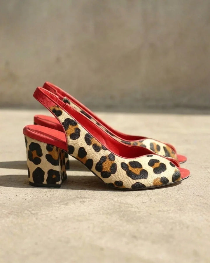 Chic women's leopard print block heel sandals, perfect peep toe summer footwear with a comfortable, elegant design.