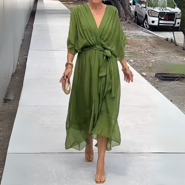 Women's elegant lightweight V-neck wrap dress. Comfortable short sleeve style, perfect as a versatile summer party dress.