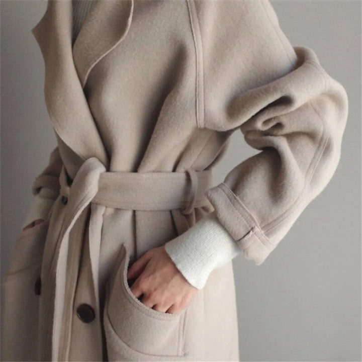 Tailored women's longline double-breasted winter coat. Smart casual outerwear for versatile elegant style.