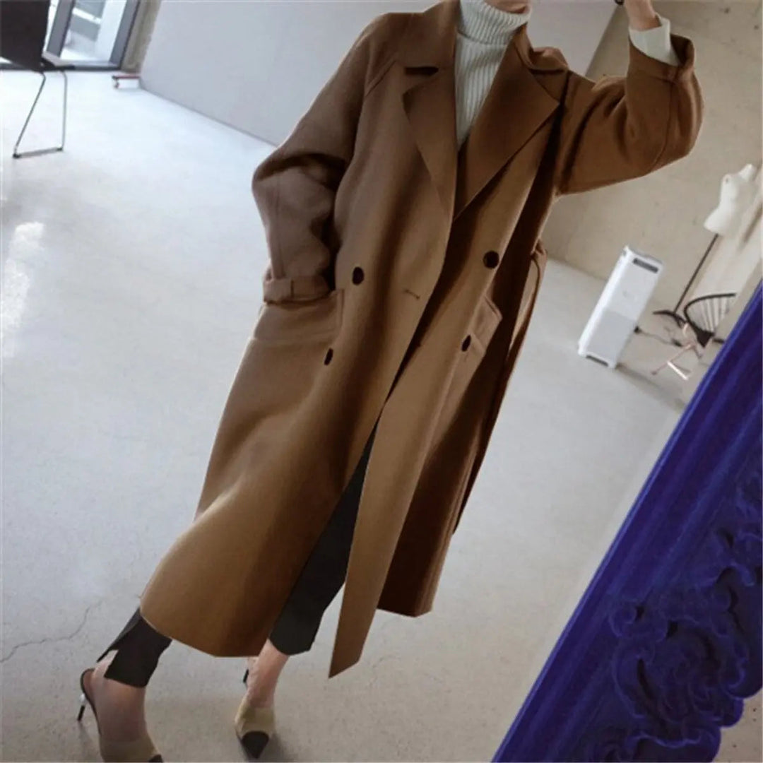 Classic women's double-breasted long coat in soft cashmere blend, ideal for elegant autumn & winter style.