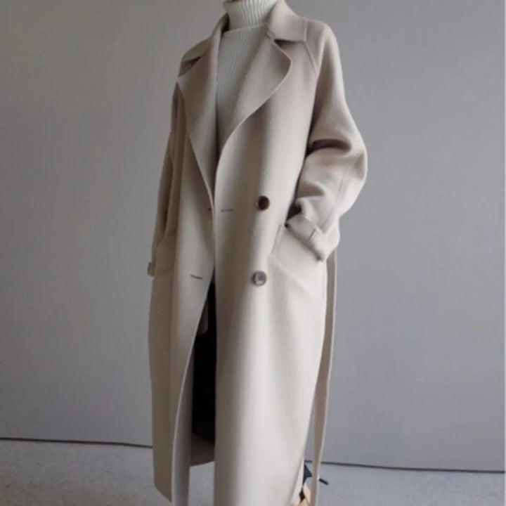 Versatile women's long double-breasted overcoat, perfect for smart casual or elegant winter outfits.