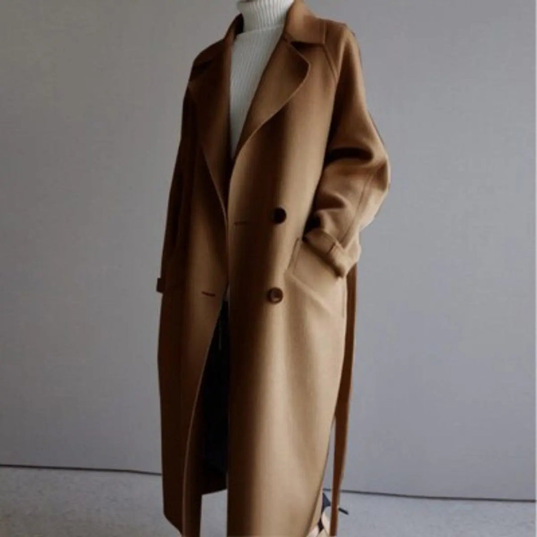 Stylish women's long cashmere double-breasted coat. Elegant and warm outerwear for cold weather fashion.