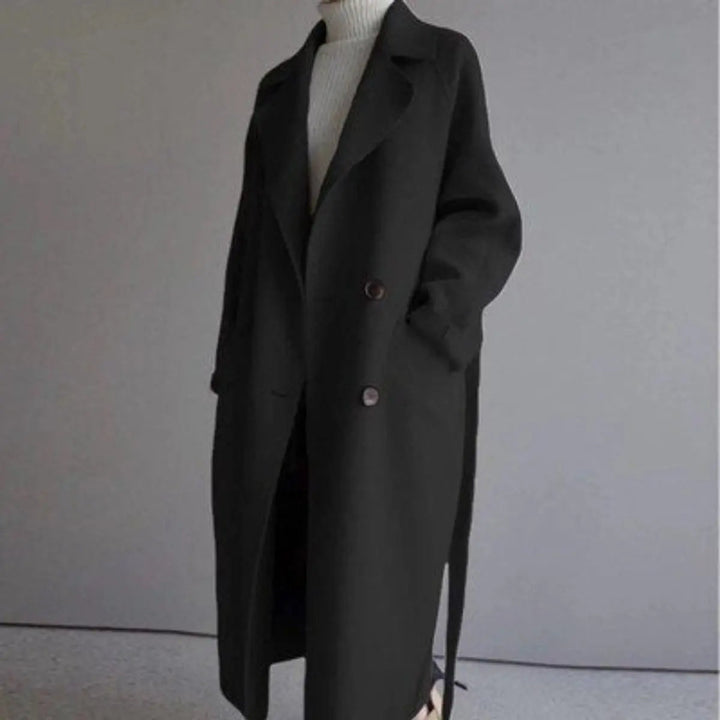 Sophisticated women's long double-breasted winter coat. A classic tailored piece for elegant autumn fashion.