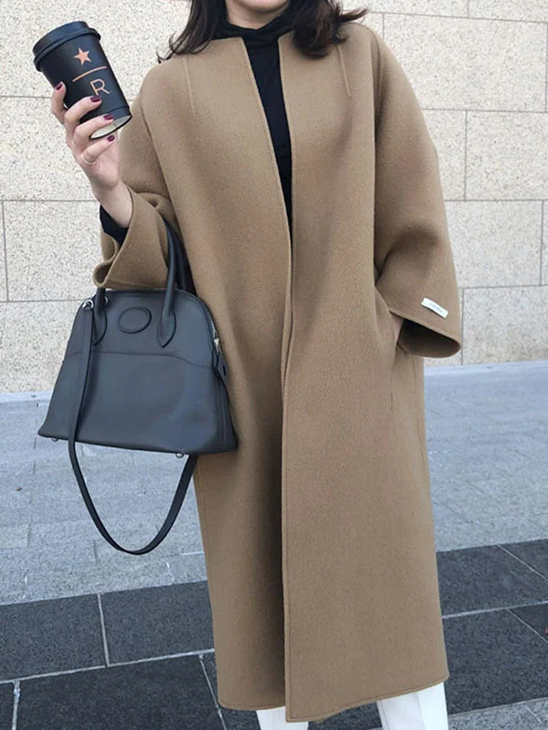 Elegant women's long open front winter coat, perfect oversized outerwear for fall and winter fashion.